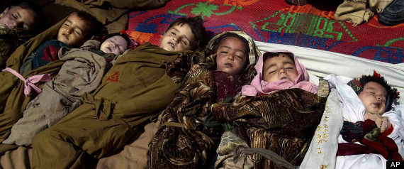 The lifeless bodies of Afghan children lay on the ground before their funeral ceremony, after a NATO airstrike killed several Afghan civilians, including ten children during a fierce gun battle with Taliban militants in Shultan, Shigal district, Kunar, eastern Afghanistan, Sunday, April 7, 2013. The U.S.-led coalition confirms that airstrikes were called in by international forces during the Afghan-led operation in a remote area of Kunar province near the Pakistan border. (AP Photo/Naimatullah Karyab)
