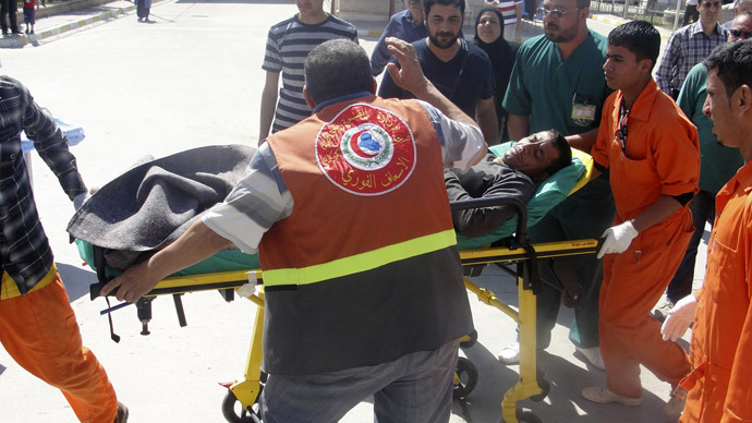 A man is brought to a hospital on a stretcher after after being wounded in a clash between Iraqi forces and Sunni Muslim protesters in Kirkuk, 250 km (155 miles) north of Baghdad April 23, 2013. (Reuters/Ako Rasheed)