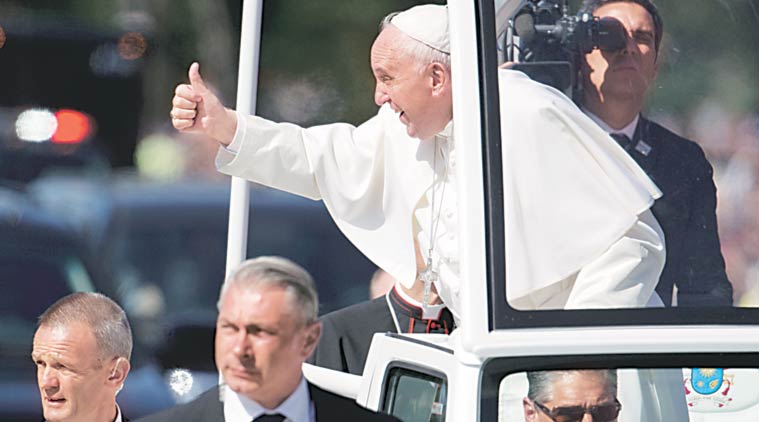 Pope Francis give the thumbs-up from the popemobile during a parade around the Ellipse near the White House in Washington, Wednesday. (Source: AP)
