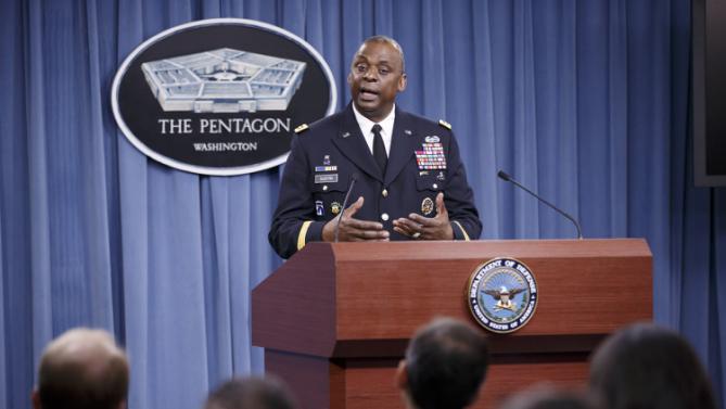 Army Gen. Lloyd J. Austin III, commander of U.S. Central Command, updates reporters at the Pentagon about the military campaign against Islamic State militants in Iraq, Friday, Oct. 17, 2014. The top U.S. commander for the Middle East says fighting over the Syrian border town of Kobani has allowed the U.S.- led coalition to take out large numbers of Islamic State group fighters that have been pouring in. (AP Photo/J. Scott Applewhite)
