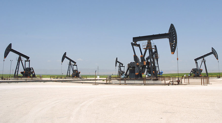 Oil pump jacks pump oil in Al-Jbessa oil field in Al-Shaddadeh town of Al-Hasakah governorate April 2, 2010. REUTERS/Stringer