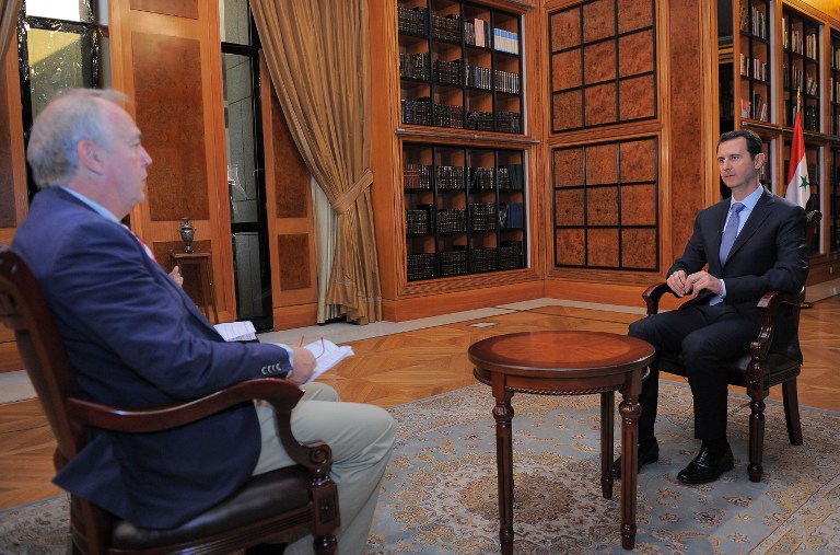 Syrian President Bashar al-Assad talks to AFP journalist Sammy Ketz