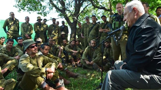 Israeli Prime Minister Benjamin Netanyahu speaks to troopers in the occupied Golan Heights on April 11, 2016.