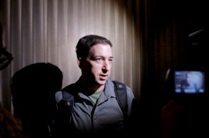 Journalist Glenn Greenwald, who first reported former NSA contractor Edward Snowden’s disclosure of government surveillance programs, speaks to reporters in June at his hotel in Hong Kong. (Vincent Yu/AP)