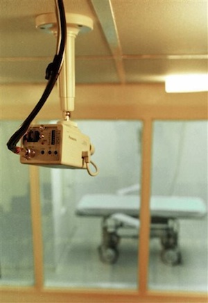 A television camera mounted on the ceiling of a witness room is pointed toward a prison death chamber. AP/Danny Johnston