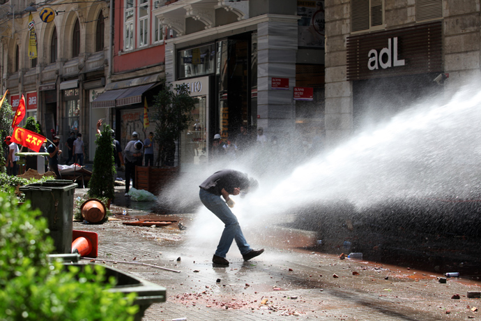 Police use a water cannon to disperse protestors near the Taksim Gezi park in Istanbul after clashes with riot police, on June 1, 2013, during a demonstration against the demolition of the park (AFP Photo / Gurcan Ozturk)