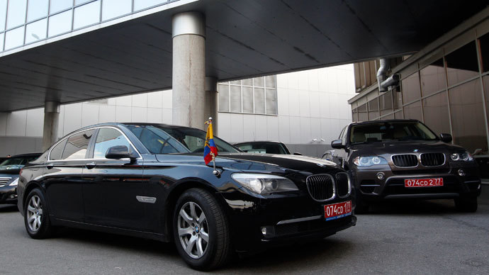 Two cars of the embassy of Ecuador in Moscow are parked outside the terminal where Edward Snowden, the former contractor for the U.S. National Security Agency, is believed to have landed in Moscow's Sheremetyevo airport, June 23, 2013.(Reuters / Maxim Shemetov)