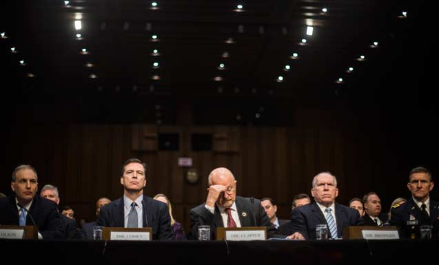 Top intelligence and defense officials of the U.S. testify before the Senate Select Committee on Intelligence on Capitol Hill, in Washington, Jan. 29, 2014. From left: National Counterterrorism Center Director Matthew Olsen, FBI Director James Comey, Clapper, CIA Director John Brennan and Defense Intelligence Agency Director Michael Flynn. (Photo: Gabriella Demczuk / The New York Times)