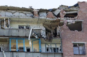 A damaged house is seen after shelling in the city of Kramatorsk, Donetsk region, eastern Ukraine, on Thursday. Residential areas came under shelling on Thursday from government forces. (Dmitry Lovetsky/The Associated Press)