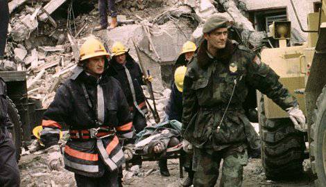 Stretchering a victim of RTS bombing, April 23, 1999
